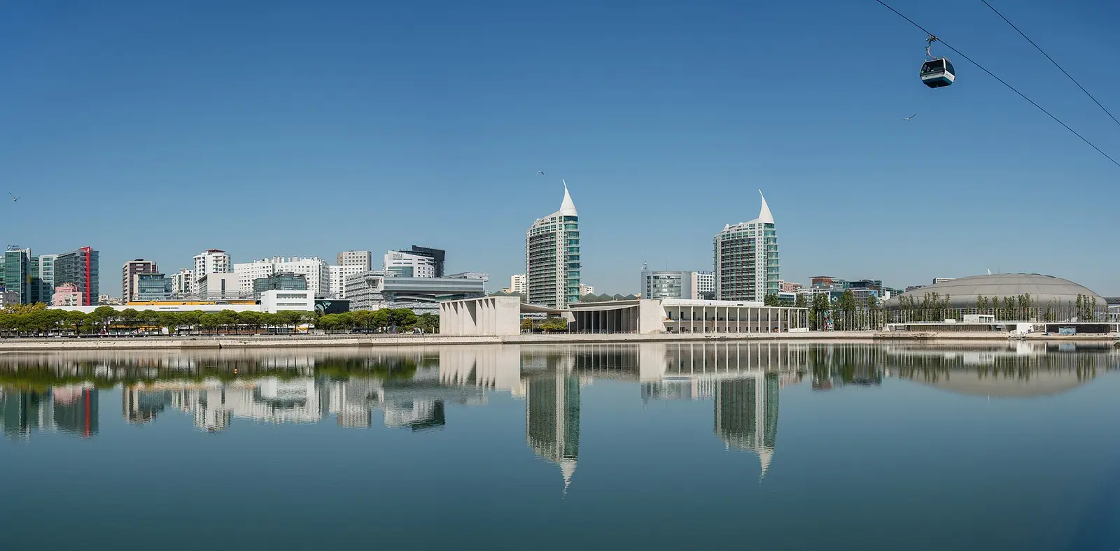 Towers and exhibition district of Parque das Nações reflected in the water in Lisbon